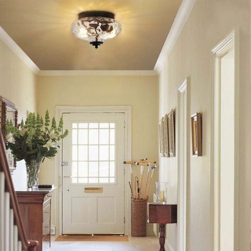 room with simple urn flush mount light