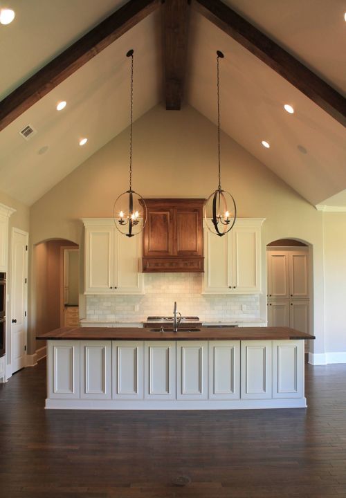 vaulted ceiling with pendant lights