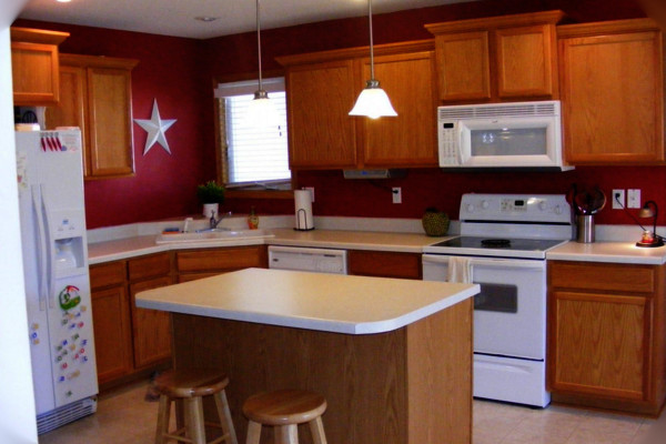 bold red kitchen color with white appliances
