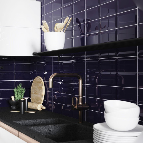 silver cabinets with dark blue tiles